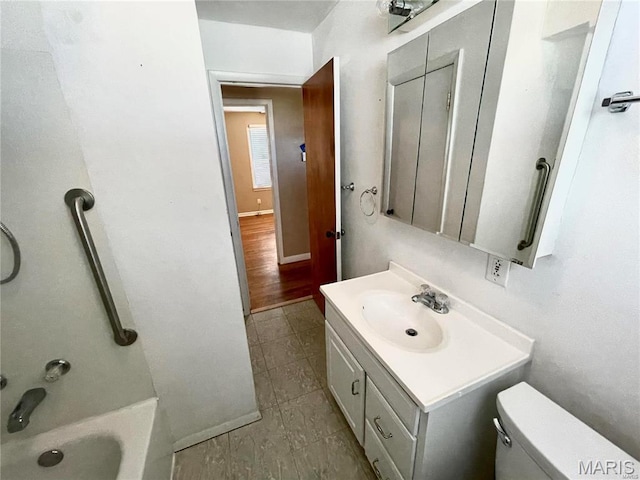 full bathroom featuring tile patterned flooring, toilet, vanity, and shower / washtub combination