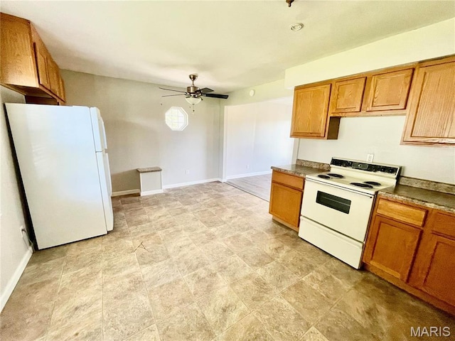 2209 Terminal Ave, Granite City, IL 62040 - kitchen with white appliances, ceiling fan, brown cabinets, dark countertops, and baseboards