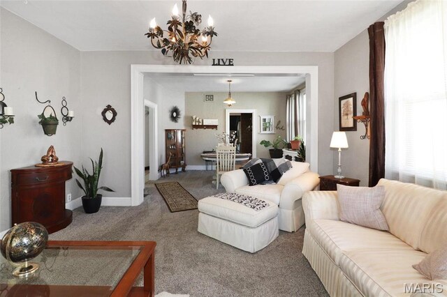 515 N Washington St, Mexico, MO 65265 - living area with a chandelier, carpet floors, and baseboards