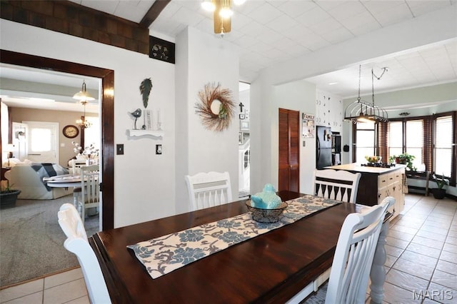 515 N Washington St, Mexico, MO 65265 - dining space with light tile patterned flooring and a chandelier