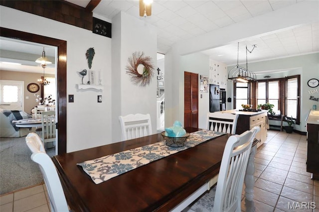 515 N Washington St, Mexico, MO 65265 - dining area featuring tile patterned floors and a chandelier