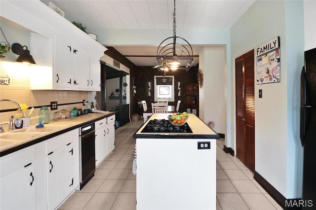515 N Washington St, Mexico, MO 65265 - kitchen featuring a center island, white cabinets, light tile patterned flooring, and a chandelier