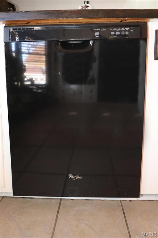 515 N Washington St, Mexico, MO 65265 - kitchen view of white cabinets and black dishwasher
