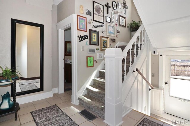 515 N Washington St, Mexico, MO 65265 - stairway featuring tile patterned floors
