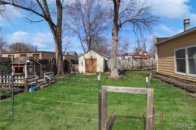 515 N Washington St, Mexico, MO 65265 - view of yard with a storage unit and an outbuilding