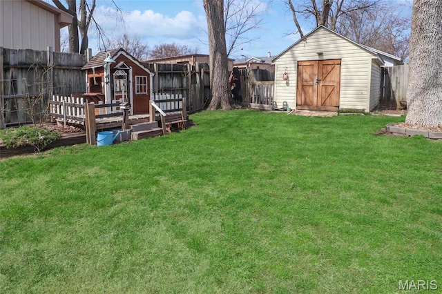 515 N Washington St, Mexico, MO 65265 - view of yard with a storage shed and an outdoor structure