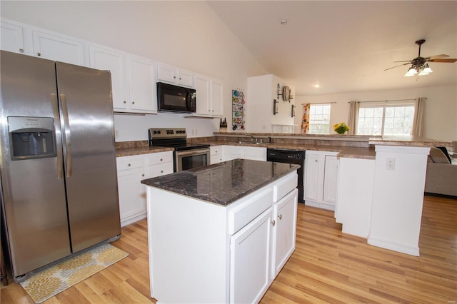 21680 N Horizonway N, Saint Robert, MO 65584 - kitchen featuring black appliances, a peninsula, light wood-type flooring, white cabinets, and high vaulted ceiling