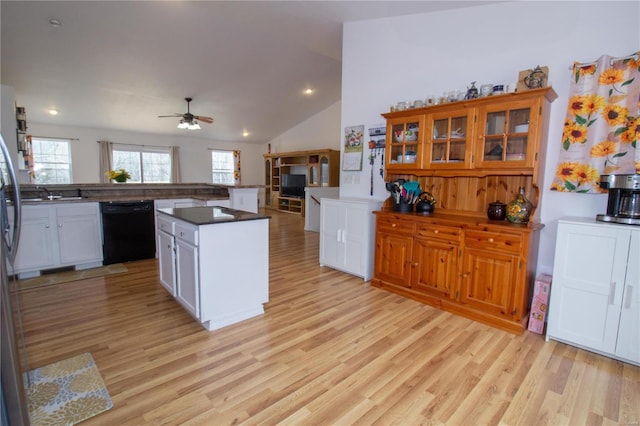 21680 N Horizonway N, Saint Robert, MO 65584 - kitchen with black dishwasher, light wood-style floors, vaulted ceiling, ceiling fan, and recessed lighting