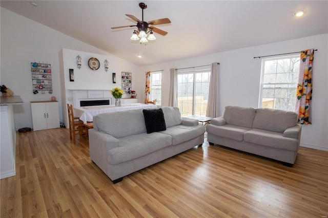 21680 N Horizonway N, Saint Robert, MO 65584 - living room with lofted ceiling, ceiling fan, light wood-style floors, healthy amount of natural light, and a fireplace