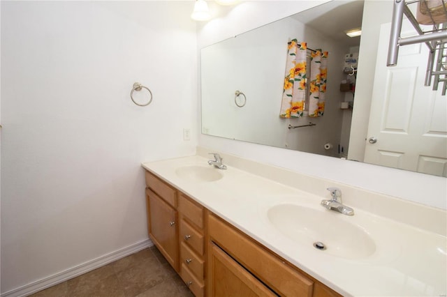 21680 N Horizonway N, Saint Robert, MO 65584 - bathroom with double vanity, tile patterned floors, and baseboards