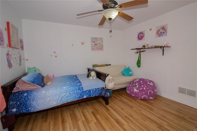 21680 N Horizonway N, Saint Robert, MO 65584 - bedroom featuring wood finished floors, a ceiling fan, and baseboards