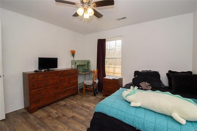 21680 N Horizonway N, Saint Robert, MO 65584 - bedroom featuring dark wood-type flooring and a ceiling fan