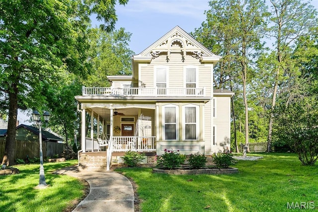 705 Jefferson St, Fulton, MO 65251 - victorian house featuring a balcony, a porch, and ceiling fan