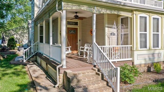 705 Jefferson St, Fulton, MO 65251 - view of exterior entry with a ceiling fan and covered porch