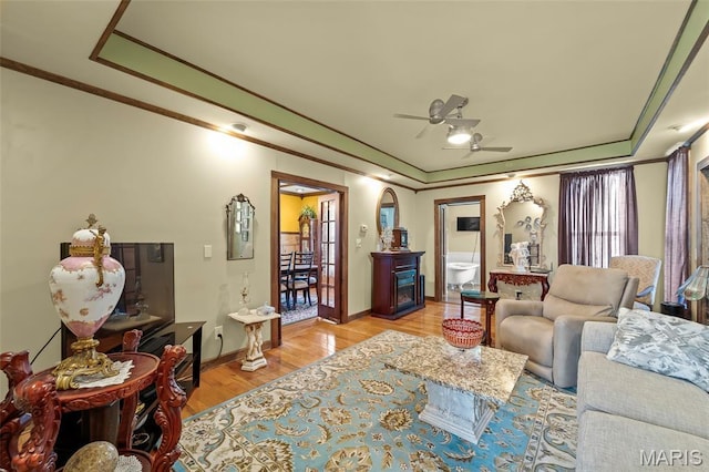 705 Jefferson St, Fulton, MO 65251 - living area featuring crown molding, ceiling fan, light wood-style flooring, and baseboards