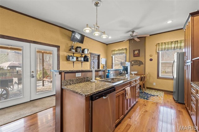 705 Jefferson St, Fulton, MO 65251 - kitchen with stainless steel appliances, a sink, light wood-style floors, dark stone counters, and ornamental molding