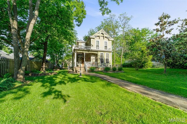 705 Jefferson St, Fulton, MO 65251 - view of front facade with covered porch and a balcony