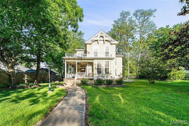 705 Jefferson St, Fulton, MO 65251 - victorian house featuring covered porch and a balcony