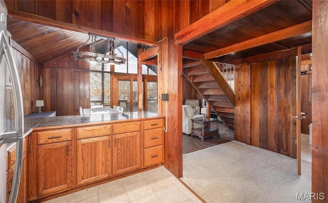 1382 Osage Rd, Cuba, MO 65453 - kitchen featuring wood walls, stainless steel fridge, brown cabinets, and wood ceiling