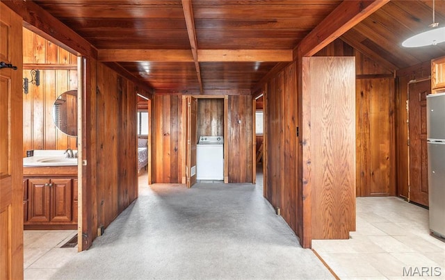1382 Osage Rd, Cuba, MO 65453 - hall featuring wood ceiling with exposed beams, washer / clothes dryer, wooden walls, and a sink