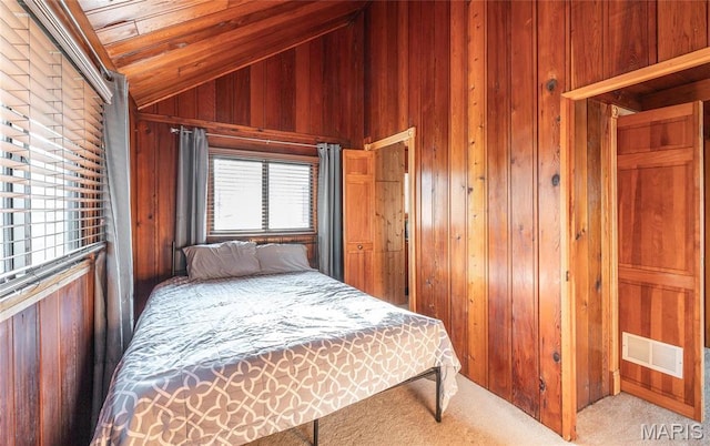 1382 Osage Rd, Cuba, MO 65453 - bedroom with lofted ceiling, wooden walls, and carpet