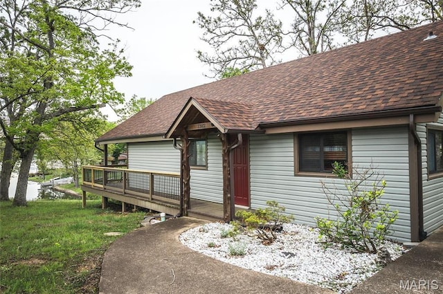 1382 Osage Rd, Cuba, MO 65453 - view of front of house featuring a shingled roof and a wooden deck