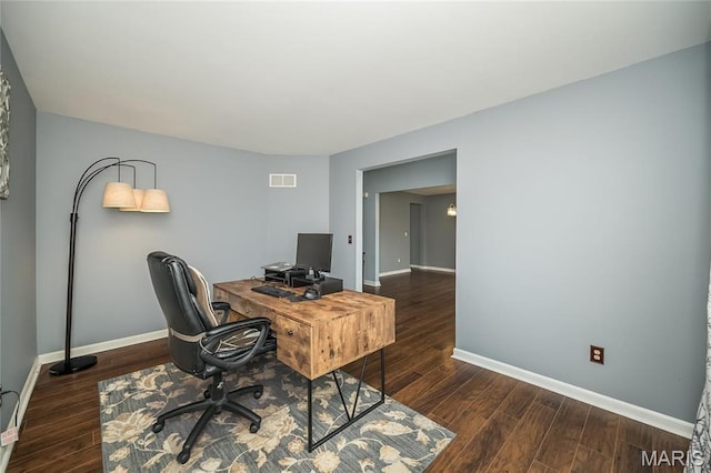 office space with baseboards and wood finished floors