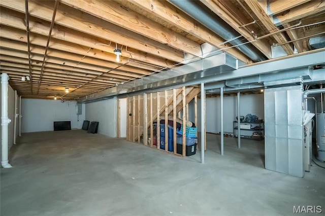 unfinished basement featuring water heater