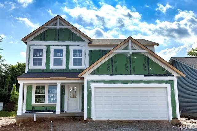 3356 Vine Clad Hill Dr, Arnold, MO 63010 - view of front of home featuring driveway, covered porch, an attached garage, and a shingled roof
