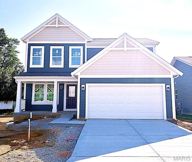 3356 Vine Clad Hill Dr, Arnold, MO 63010 - craftsman house featuring driveway, a porch, and an attached garage