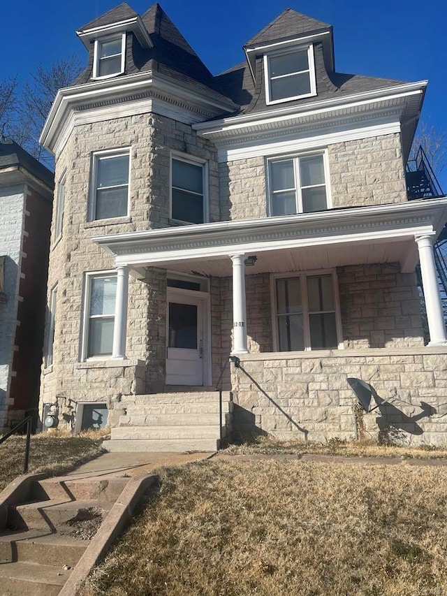 5211 Ridge Rdg, Saint Louis, MO 63113 - view of front of home with a porch and stone siding