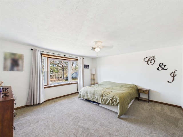 16892 Beaufort Rd, Crocker, MO 65452 - bedroom with carpet flooring, a textured ceiling, baseboards, and a ceiling fan
