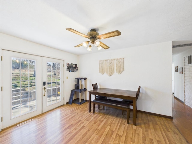 16892 Beaufort Rd, Crocker, MO 65452 - dining space with french doors, light wood-style flooring, ceiling fan, and baseboards