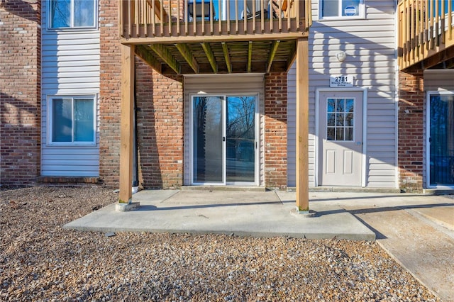 2781 Blackforest Dr Unit B, Saint Louis, MO 63129 - view of exterior entry with brick siding and a balcony