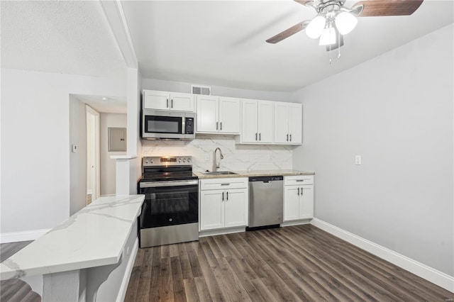 2781 Blackforest Dr Unit B, Saint Louis, MO 63129 - kitchen featuring appliances with stainless steel finishes, a sink, dark wood-style floors, baseboards, and backsplash