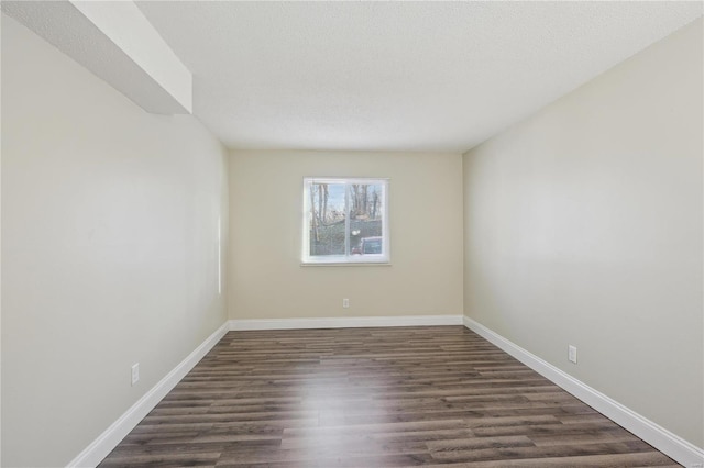 2781 Blackforest Dr Unit B, Saint Louis, MO 63129 - empty room featuring dark wood-style flooring and baseboards