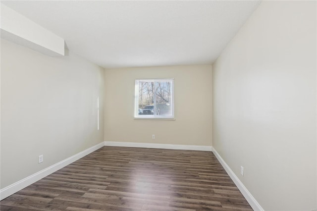 2781 Blackforest Dr Unit B, Saint Louis, MO 63129 - spare room featuring baseboards and dark wood-type flooring