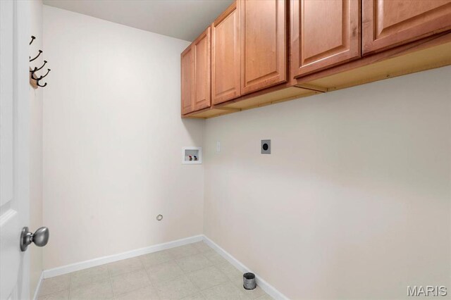 724 E Wesley Dr, Ofallon, IL 62269 - laundry room with cabinet space, hookup for a washing machine, hookup for an electric dryer, and baseboards