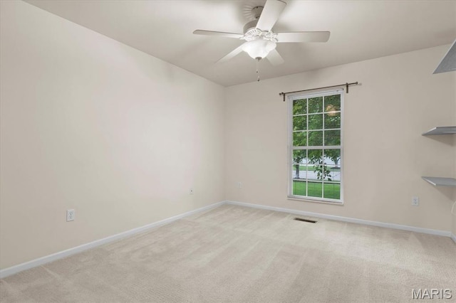 724 E Wesley Dr, Ofallon, IL 62269 - carpeted spare room with baseboards and a ceiling fan