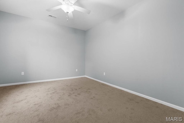 724 E Wesley Dr, Ofallon, IL 62269 - spare room featuring carpet flooring, baseboards, and a ceiling fan