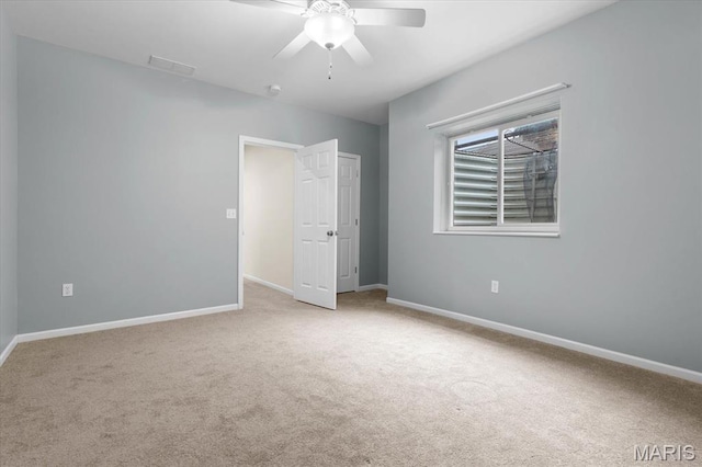 724 E Wesley Dr, Ofallon, IL 62269 - unfurnished bedroom featuring carpet and baseboards