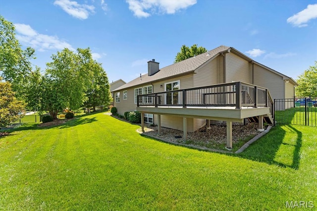 724 E Wesley Dr, Ofallon, IL 62269 - back of house featuring a wooden deck and a chimney