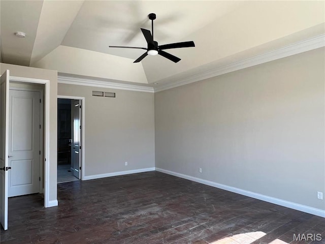 unfurnished bedroom with baseboards, dark wood-style floors, crown molding, vaulted ceiling, and a tray ceiling