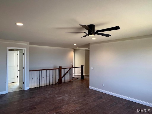 unfurnished room featuring a ceiling fan, recessed lighting, baseboards, and dark wood-style flooring