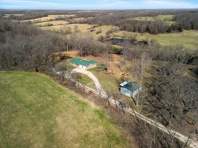 aerial view of property and surrounding area featuring rural landscape