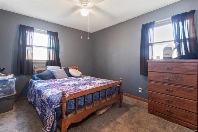 bedroom featuring carpet, baseboards, and a ceiling fan