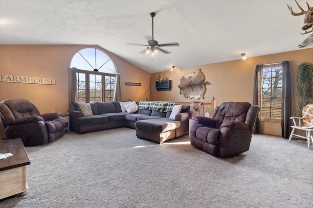 living room featuring carpet, ceiling fan, lofted ceiling, and healthy amount of natural light
