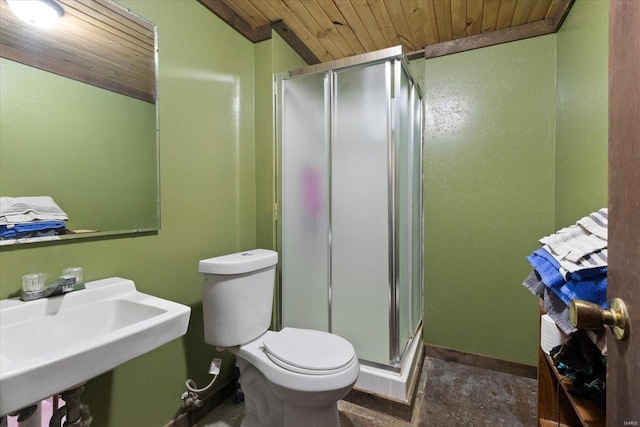 bathroom with wooden ceiling, a stall shower, toilet, a sink, and baseboards