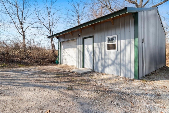 view of outbuilding featuring an outdoor structure and dirt driveway