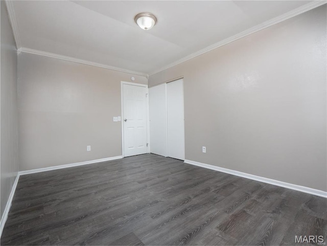 1464 Monopoly Dr, Florissant, MO 63031 - unfurnished room featuring ornamental molding, dark wood-style floors, and baseboards